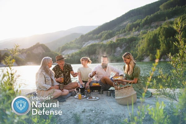 A healthy family celebrates the holidays outdoors - Liquivida Natural Defense