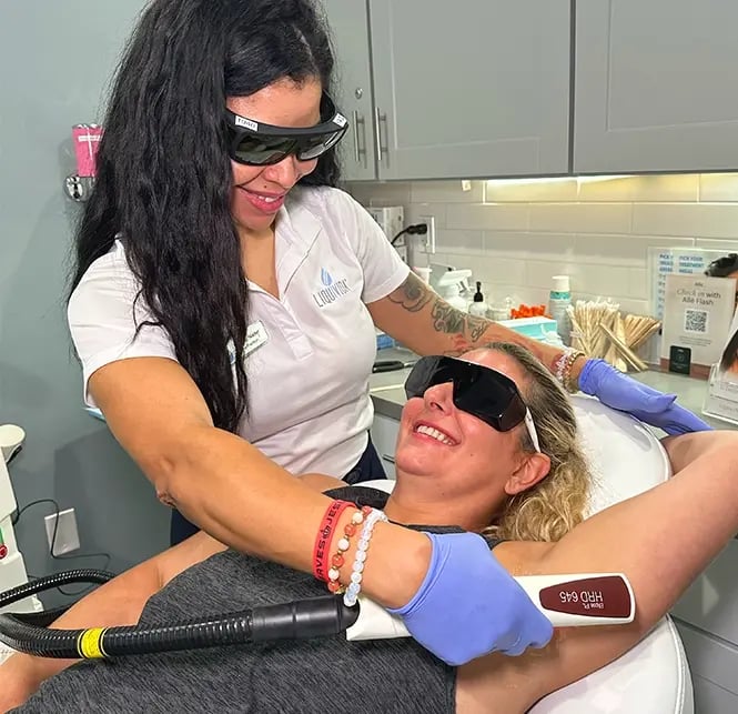 Liquivida client gets hair removal treatment on her arms