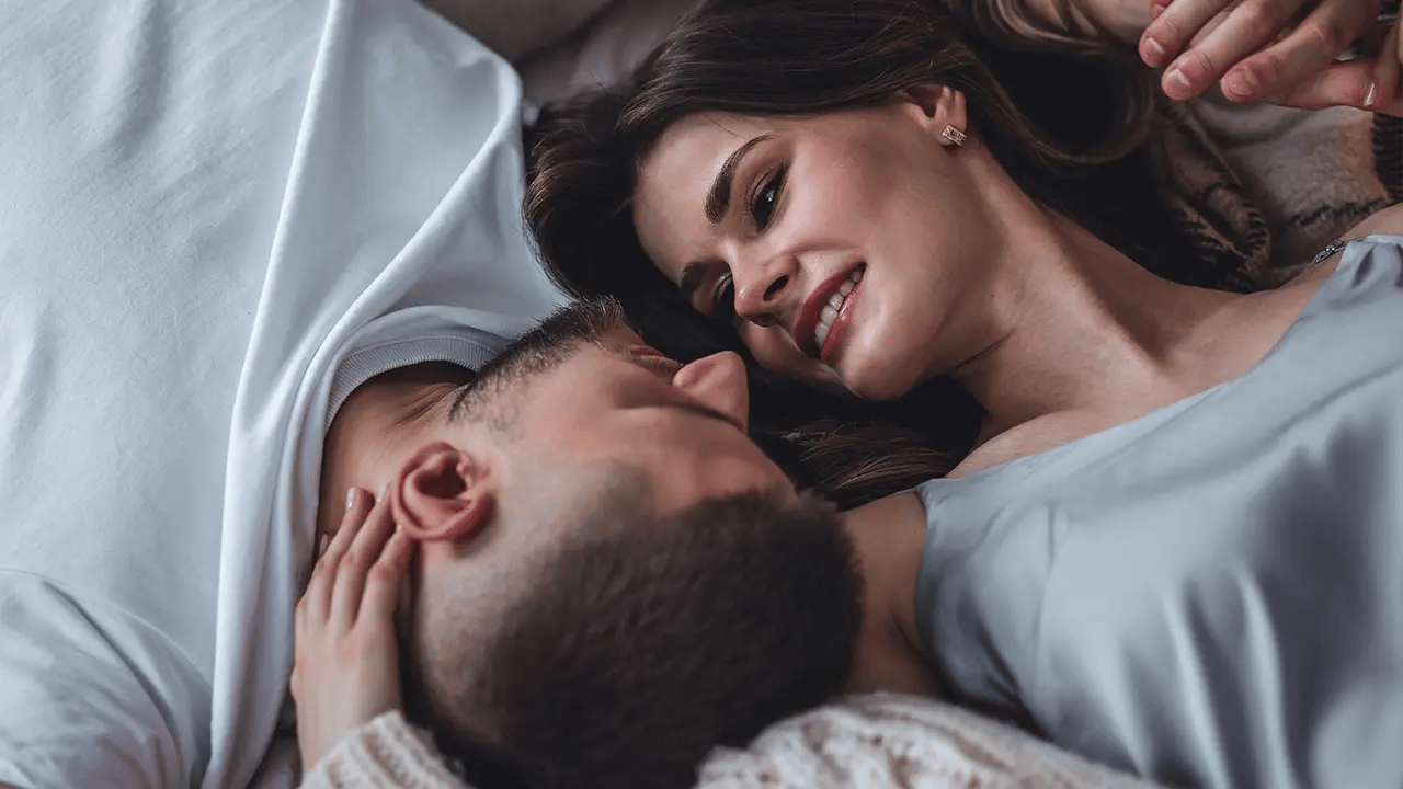 Couple in bed enjoy the benefits of a Sexual Wellness treatment at Liquivida Wellness Center