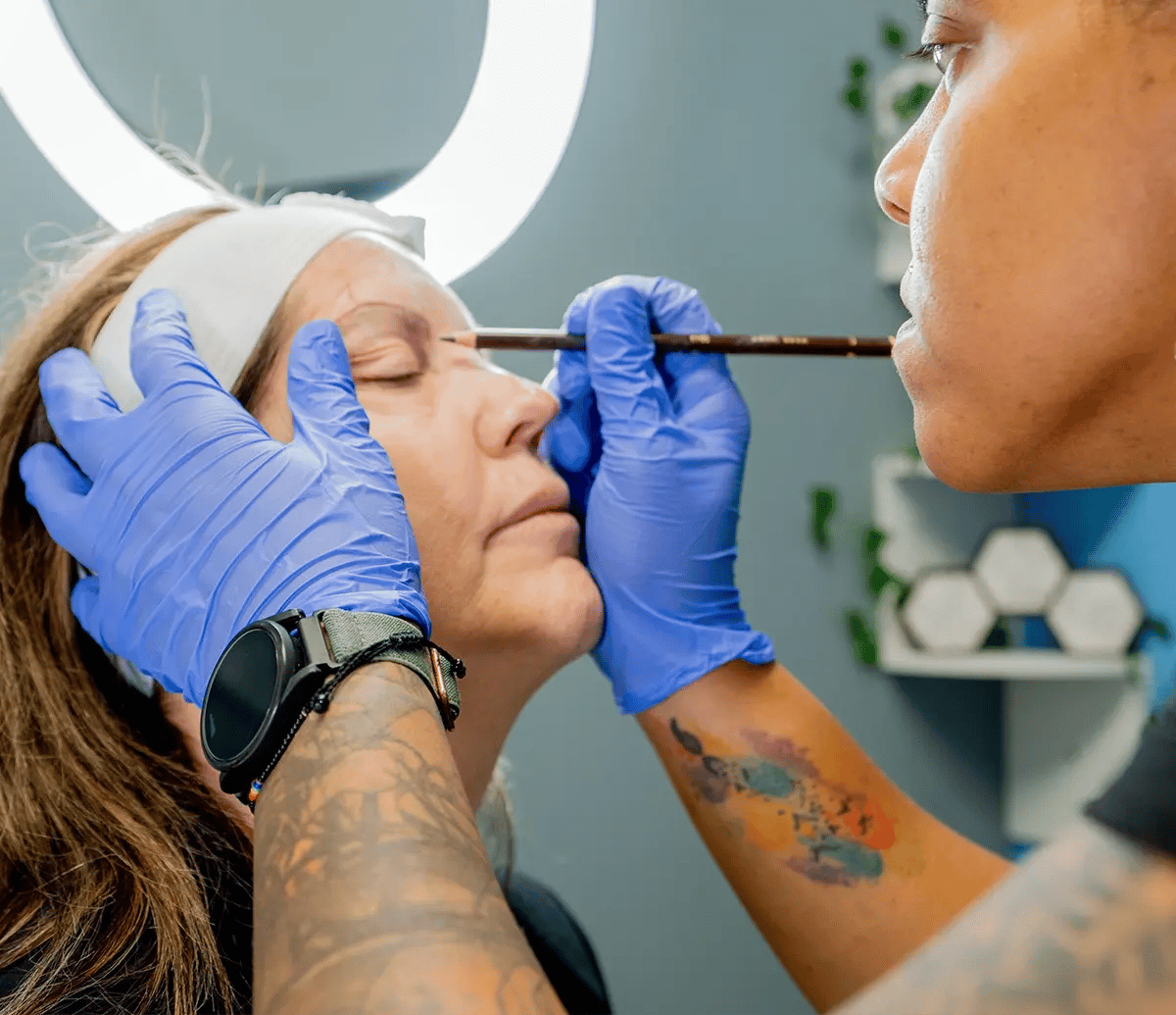 Woman preparing for permanent tattooing of her eyebrows at Liquivida