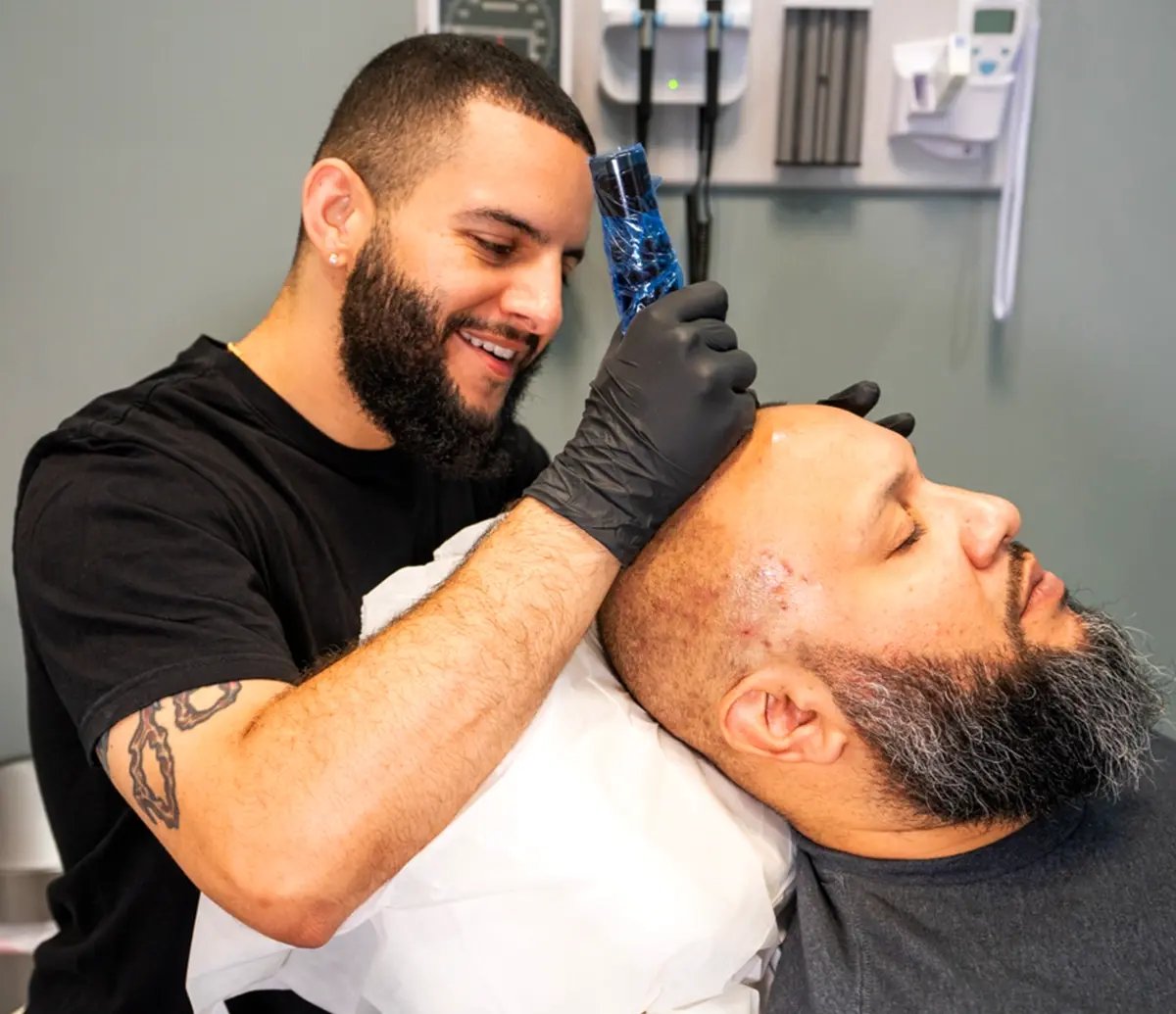 Man providing scalp micropigmentation for men at Liquivida in Pembroke Pines