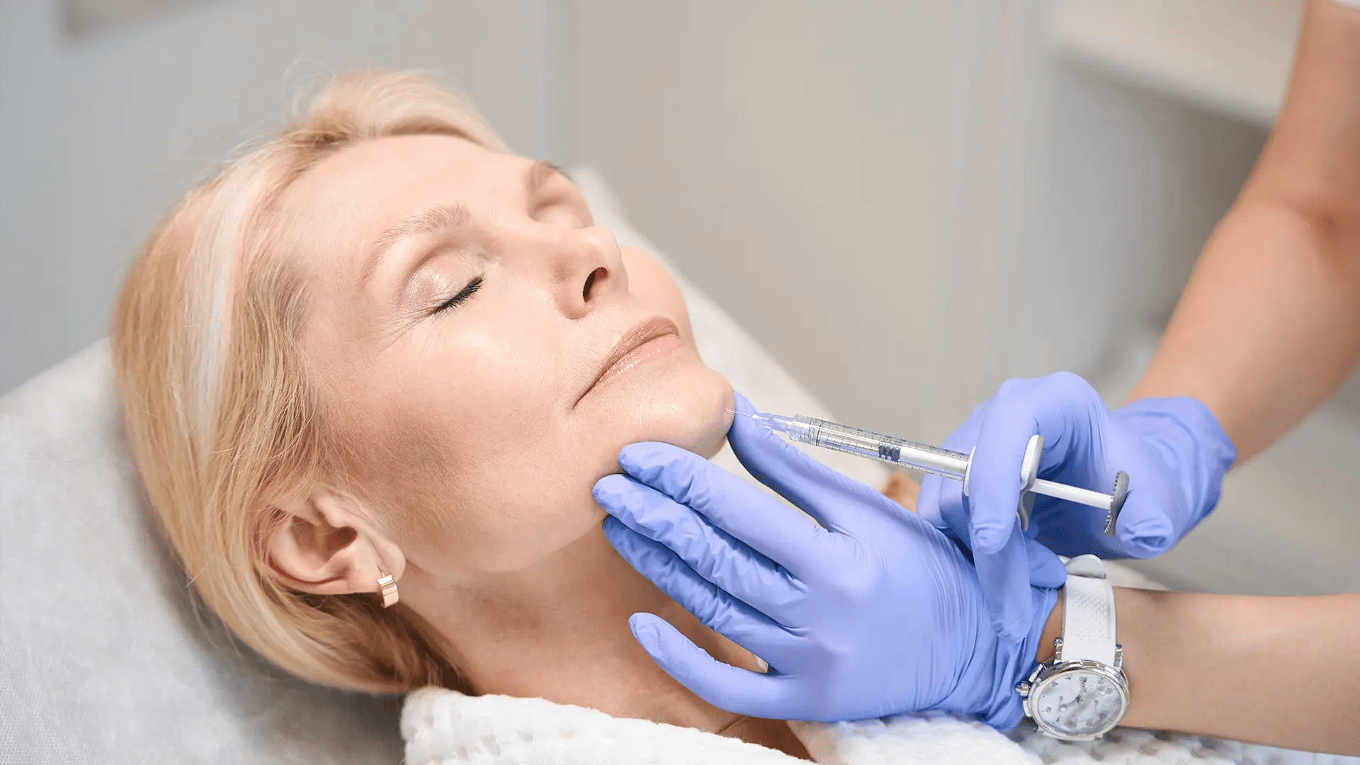 White mature women gets a Botox shot on her chin at Liquivida Wellness Center