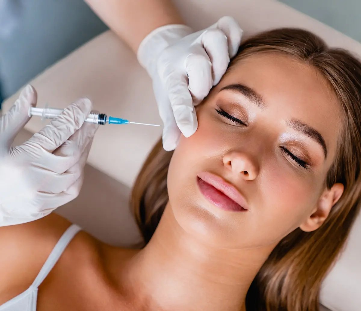 Relaxed woman waiting to get Juvederm applied to her face at Liquivida