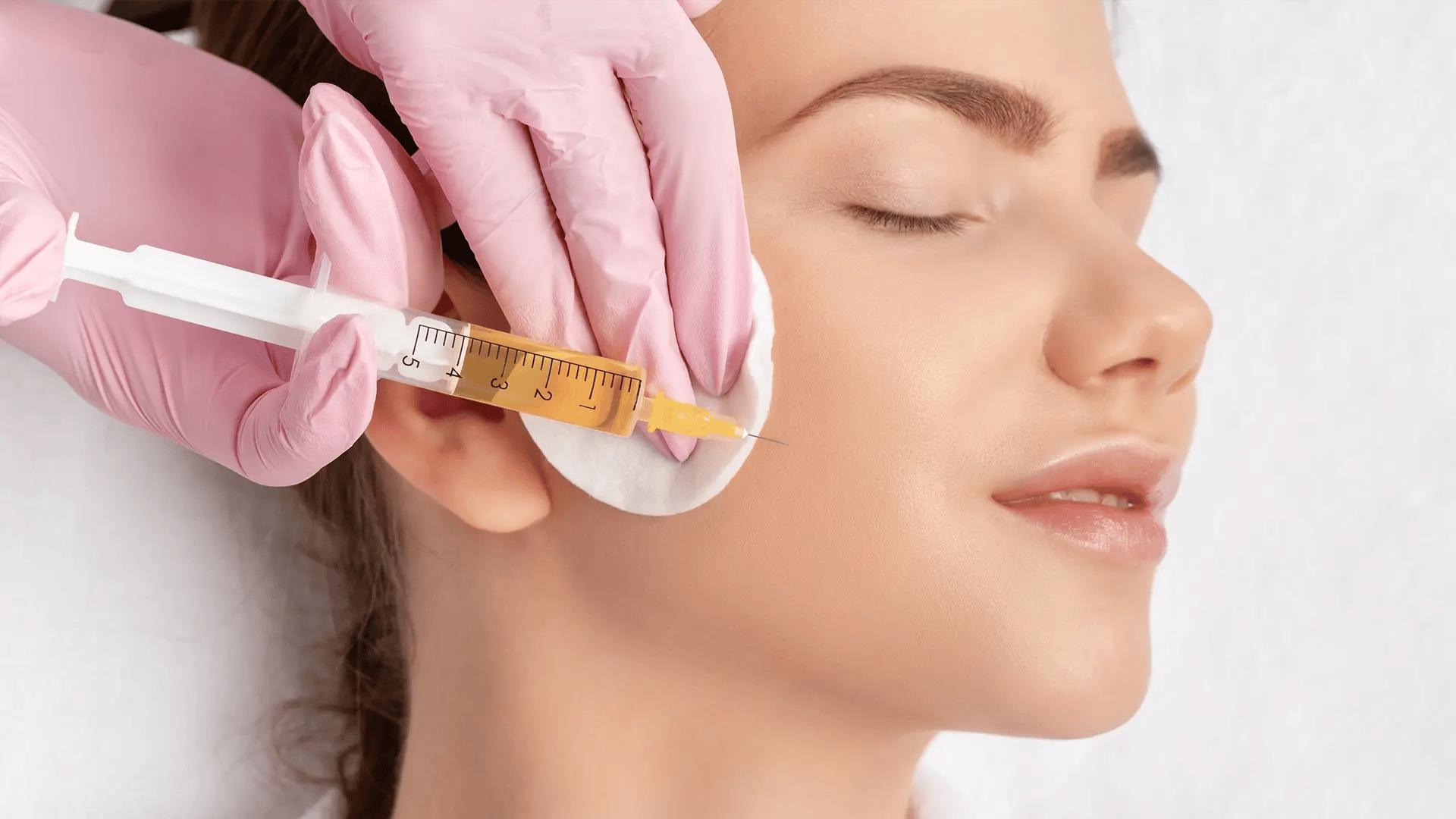 Woman getting a PRP facial on her right cheek at Liquivida Wellness Center