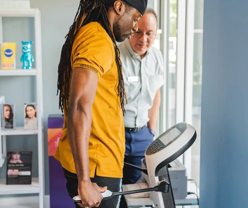 Male undergoing an Inbody scan as part of his Enlightened Living Program at Liquivida Wellness Center