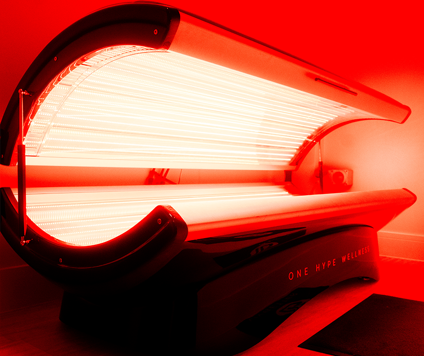 A red light therapy bed is semi-open at Liquivida