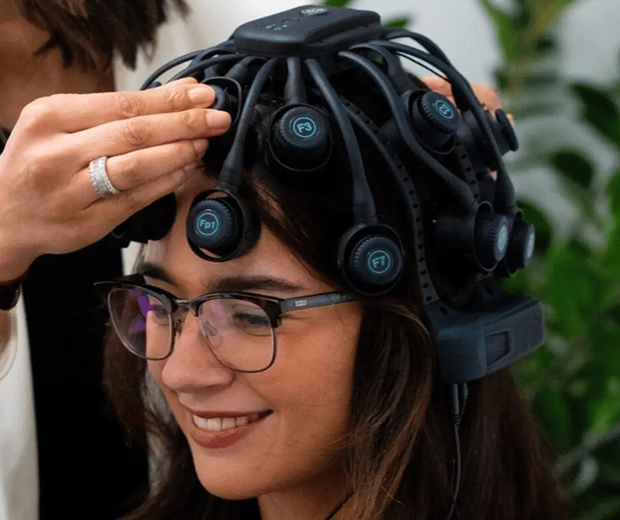 Woman wearing a One Brain X helmet for brain mapping