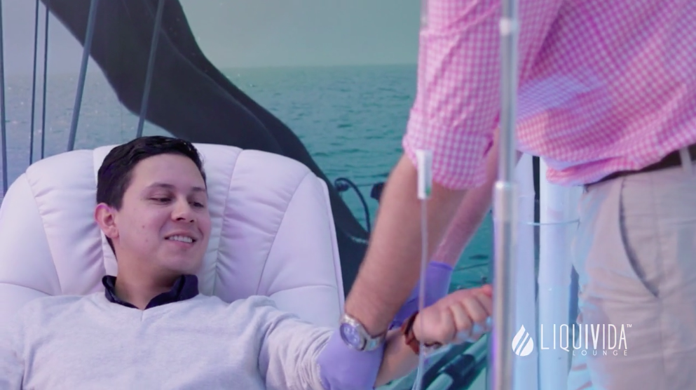young man receiving vitamin IV therapy 