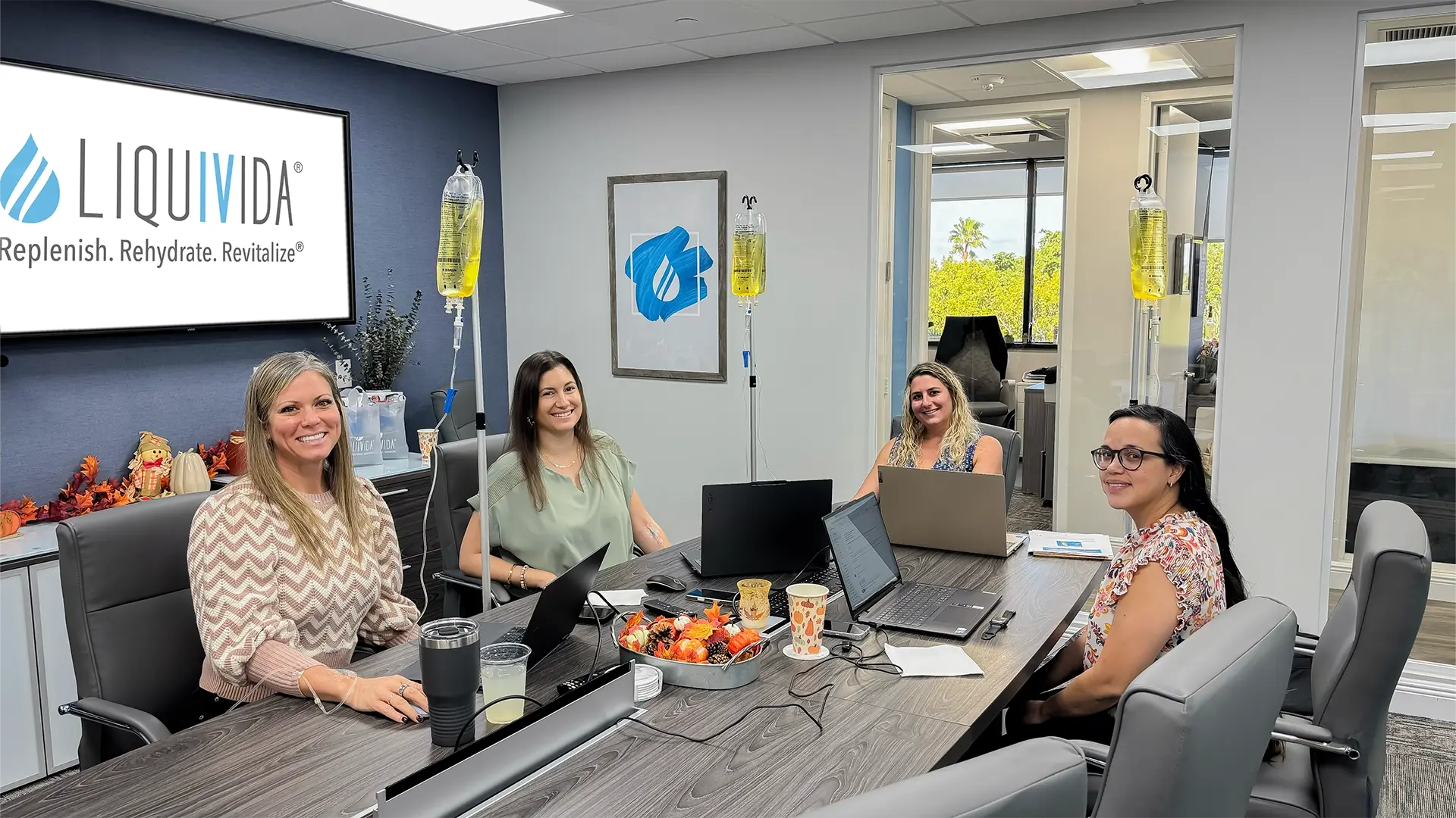Female executives get IV drips at the office from Liquivida at Work