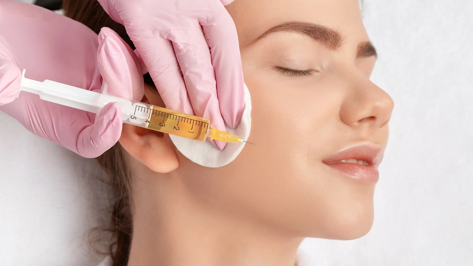 Woman getting a PRP facial on her right cheek at Liquivida Wellness Center