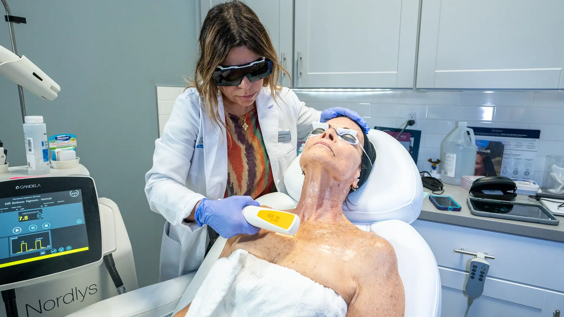 Woman getting Nordlys treatment on her chest for skin tightening at Liquivida Wellness Center